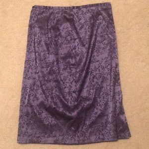Knee length purple skit with black flowers